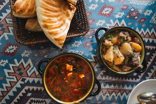 Traditional Kyrgyz Soup and Bread on Textile