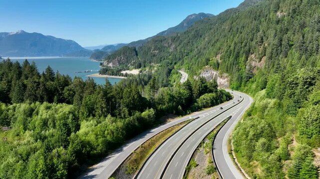 Aerial Tracking Shot of Sea to Sky Highway Curving Along Howe Sound Coast, BC Canada