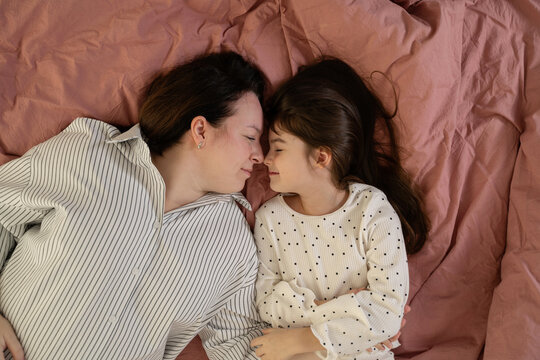 Mother and daughter sharing a tender moment at home