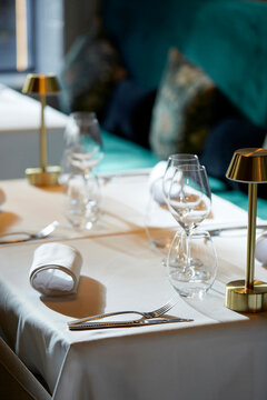 Elegant table setting with wine glasses in gourmet restaurant
