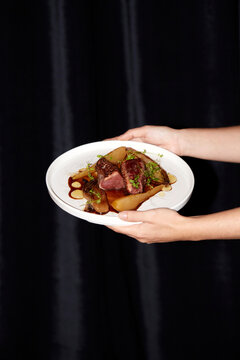 Exquisite gourmet dish served on elegant white plate