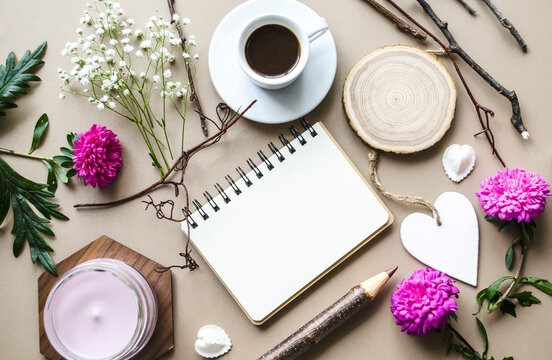 Valentine's Day flatlay with flowers and notebook