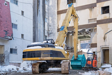 Demolition Excavator Tearing Down High‑Rise Building