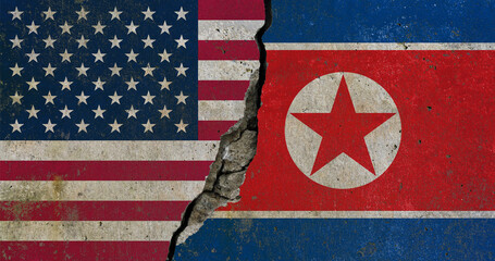 Obraz premium United States and North Korea flags divided by cracked wall symbolizing geopolitical tension