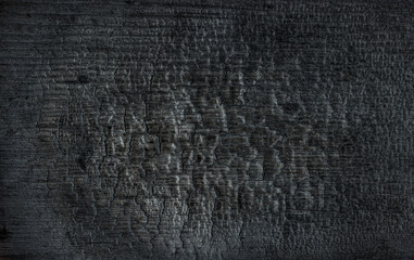  Black charred and scorched wood background 