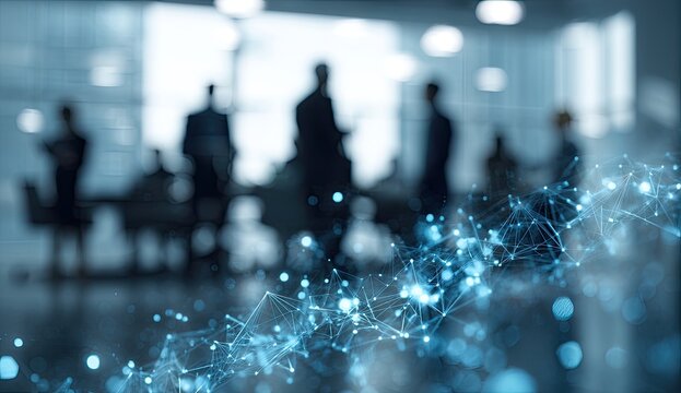 Blurred silhouettes of business people in a modern office with a glowing blue network overlay.