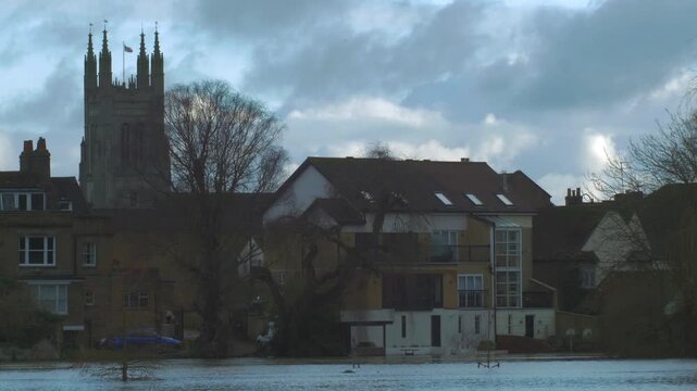 riverside buildings, church, houses, flooded river, winter flood, evening, St Neots, Huntingdonshire, Cambridgeshire, England