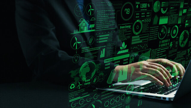 A business professional interacts with digital data on a laptop, showcasing graphs and statistics related to green energy and sustainability, highlighting innovation and analysis. Cipher