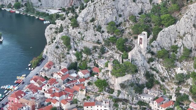 Historic center of Omis with Mirabela fortress rising above town, Dalmatia, Croatia.