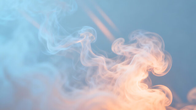 Close-up of swirling orange and blue smoke against a clear blue background with a dreamy atmosphere.