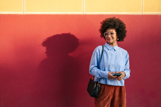 Woman in downtown with a colorful urban backdrop