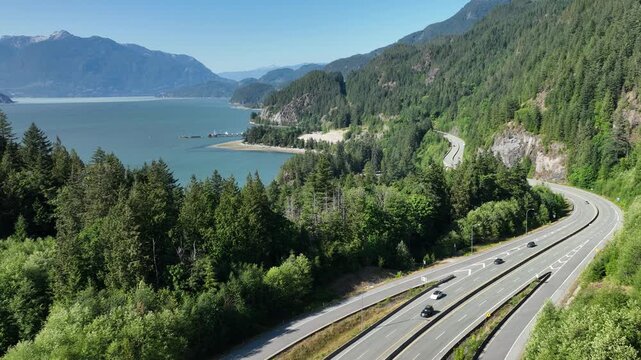 Forward Aerial Shot Over Sea to Sky Highway Curving Along Howe Sound Coast, BC Canad