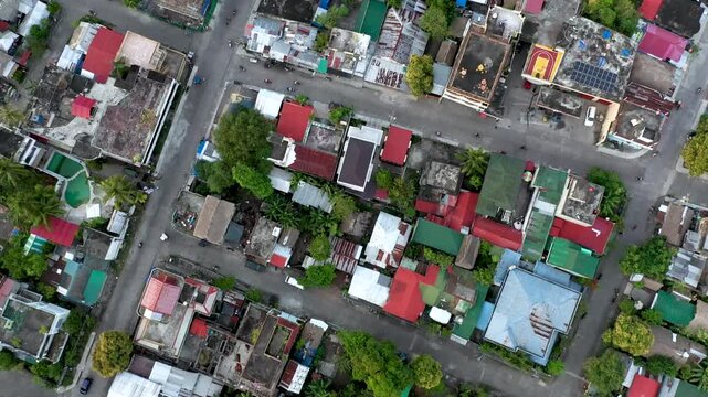 Top-down aerial view of Donsol town with roads, buildings, and trees, Philippines