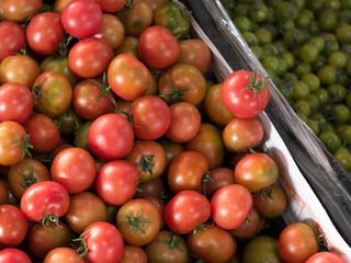 Red and Green Tomatoes at Market Stalls
