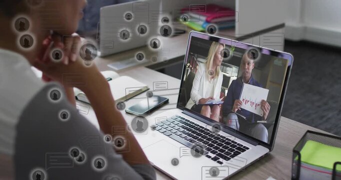 Woman viewer watching laptop causing floating message icons over finance desk showing red-bar chart