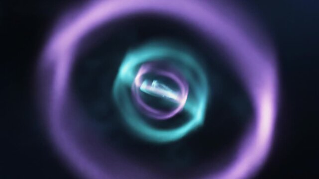 A futuristic abstrack motion scene featuring rings, light, energy, vortex, and motion in a dark, cosmic environment from a centered viewpoint