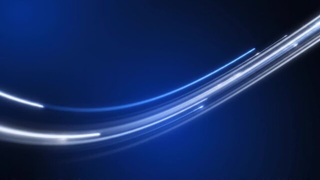 Dynamic abstrack motion of light trails curving through a dark blue environment from a close-up viewpoint
