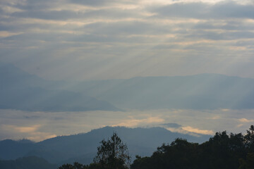 Obraz premium sunrise with moving of cloud and clear sky and layer of mountain