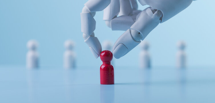 AI Robot Hand Selecting a Unique Red Wooden Figure for Recruitment Concept