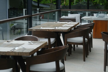 Obraz premium Luxuriously Set Square Wooden Table with Soft Ambient Lighting