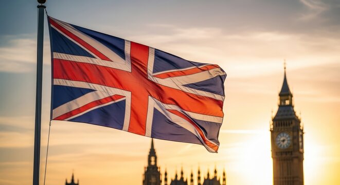 Union Jack waving proudly against a backdrop of Westminster Palace at sunset creating a scene