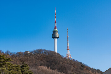 Fototapeta premium N Seoul Tower with autumn landscape. It is also known as Namsan Tower or Seoul Tower, the landmark which is a communication and observation tower located on Nam Mountain in central Seoul, South Korea