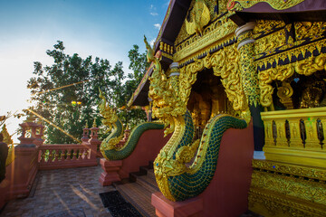 Naklejka premium Landmark Sunrise with sky at Wat Phra That Doi Phra Chan on the top hill of Doi Phra Chan mountain in Mae Tha, Lampang province, Thailand