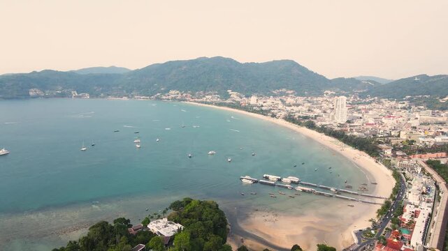 Aerial view beautiful Patong Beach in Phuket Thailand, Landscape of patong city phuket in sunny summer day time, Beautiful tropical sea,High angle view Sea beach Sunset in the evening