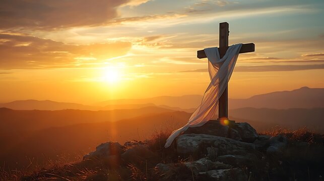 Wooden cross draped with white cloth on a mountain top at sunrise, symbolizing hope and resurrection