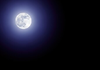 Obraz premium A high-resolution, detailed photograph capturing the bright full moon illuminating the deep blackness of the expansive cosmic nighttime sky, silent, lunar, moon