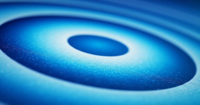 Close-up of a vibrant blue circular pattern with a central dot, showcasing texture and depth