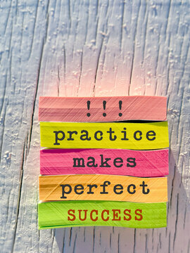 Motivational quote practice makes perfect success written on colorful sticky notes. Personal development and success mindset concept.
