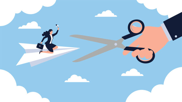 Giant hand with scissors prepares to cut a paper airplane flown by a businesswoman to symbolize budget cuts or halted progress.