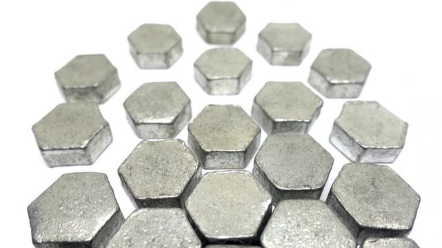 View above an arrangement of metal hexagons that becomes less tightly packed together.