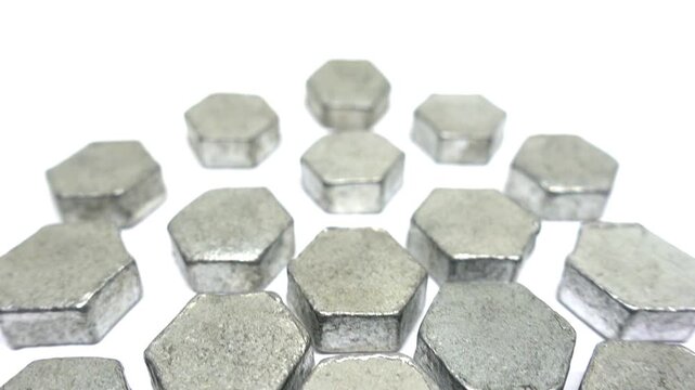 View moving low and rising above pattern of metal hexagons.