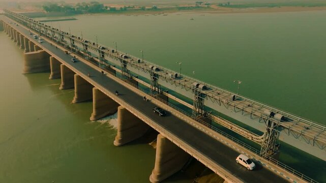 Aerial view showing traffic crossing the Kotri Barrage dam and bridge over the Indus River