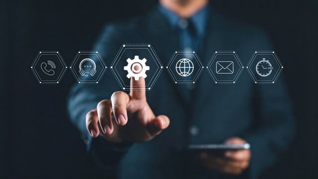 Businessman pressing virtual customer service interface icons,contact support,automation settings and communication technology concept for digital transformation strategy in modern enterprise
