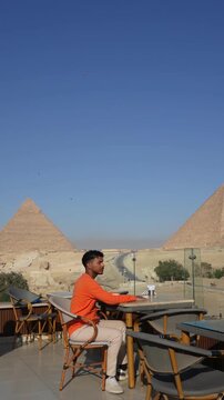 Relaxing above the Great Pyramids of Giza in Egypt