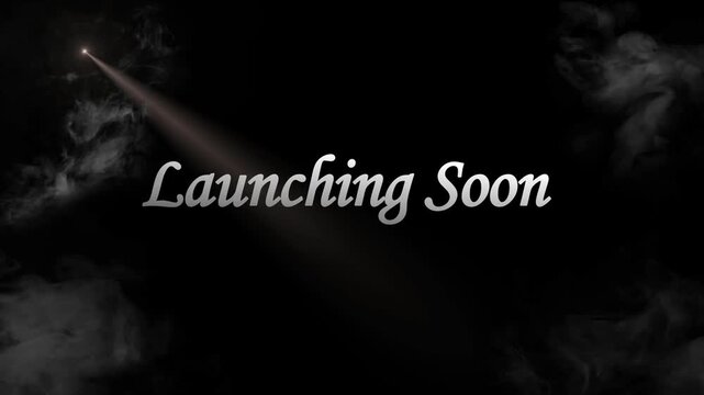 This striking graphic features the elegant phrase "Launching Soon" illuminated by a single, dramatic spotlight, casting a mysterious yet exciting glow on a dark, smoky background, perfectly conveying 