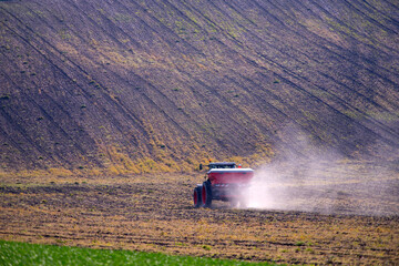 Fototapeta premium Tractor working on the field in Moravia