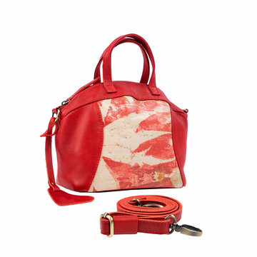 Beautiful oramge leather bag for women with floral ecoprint motif isolated on white background. Perfect for leather product catalog design.