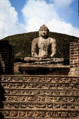 Fototapeta premium Ancient Granite Seated Buddha Statue at the Polonnaruwa Vatadage Archaeological Site