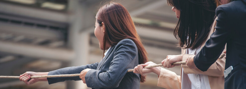 Banner Tug of war Businesswoman Team holding hands together partnership leader teamwork. Banner Group of business people Hands pulling rope symbol team unified teamwork Partnership with copy space