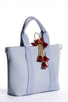 Women's blue leather bag on a white background