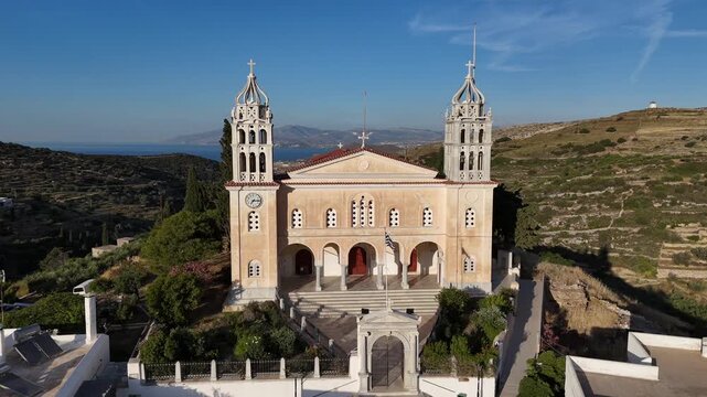 Paros Island,Lefkas Village,Aerial view backwards from the Holy Trinity Lefkes Orthodox Church, sea and hills at the background on a sunny day.