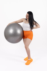 Fototapeta premium Fit woman with exercise ball on white background