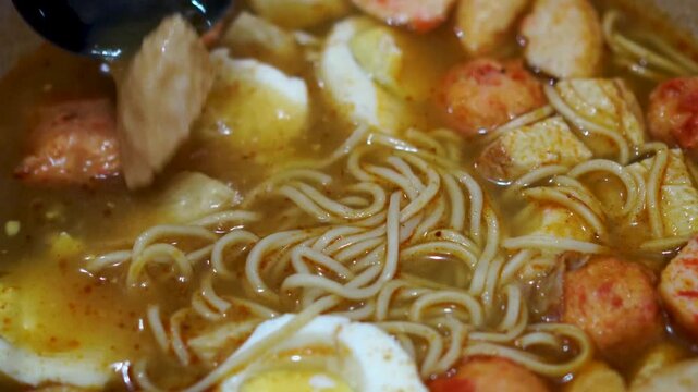 Spicy Noodle Soup with Boiled Eggs and Fish Balls