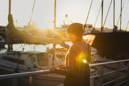 girl at sunset in the harbour