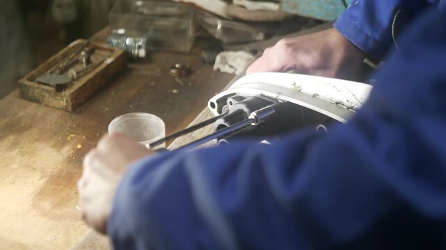 Servicing water pump outboard motor mechanic