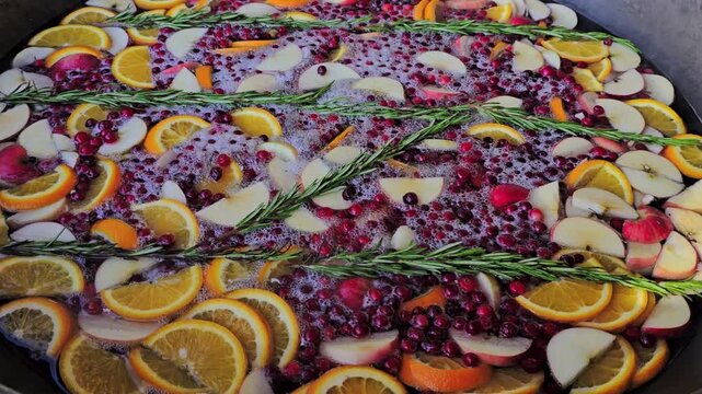fruit compote in a vat at a street fair close-up. Fruity rosemary punch. High quality 4k footage